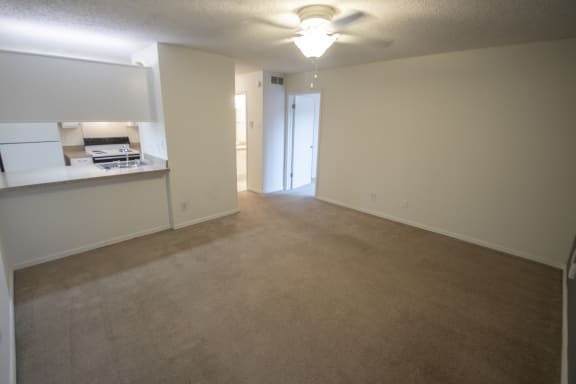 This is a photo of the living room of a 582 square foot 1 bedroom apartment at Cambridge Court Apartments in Dallas, TX.
