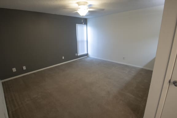 This is a photo of the living room of a 582 square foot 1 bedroom apartment at Cambridge Court Apartments in Dallas, TX.