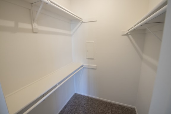 This is a photo of the walk-in closet in the bedroom of a 612 square foot 1 bedroom apartment at Cambridge Court Apartments in Dallas, TX.