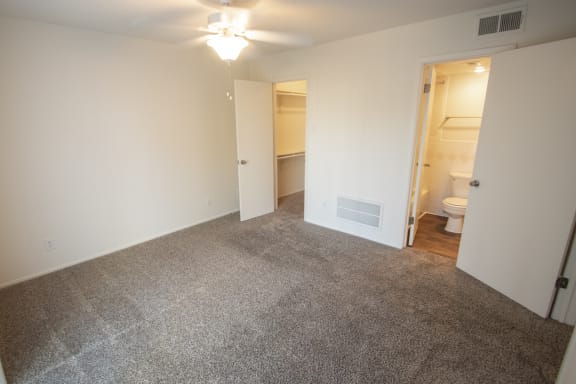 This is a photo of the bedroom of a 612 square foot 1 bedroom apartment at Cambridge Court Apartments in Dallas, TX.