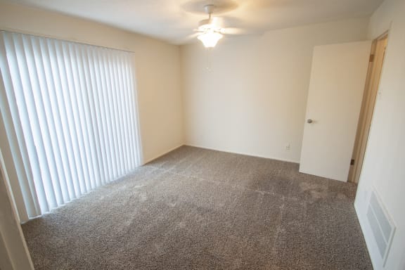 This is a photo of the bedroom of a 612 square foot 1 bedroom apartment at Cambridge Court Apartments in Dallas, TX.