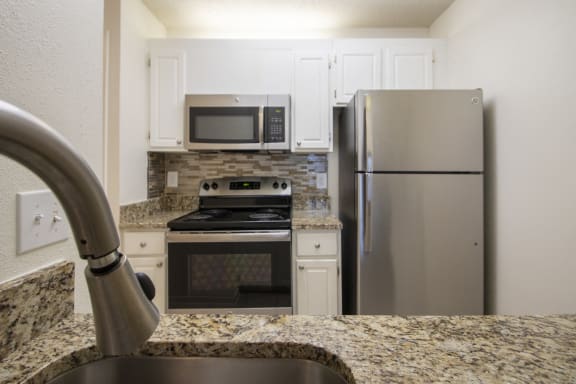 This is a photo of the kitchen of a 612 square foot 1 bedroom apartment at Cambridge Court Apartments in Dallas, TX.