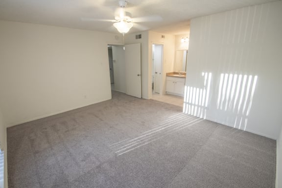 This is a photo of the master bedroom of a 1086 square foot 2 bedroom  apartment at Cambridge Court Apartments in Dallas, TX.