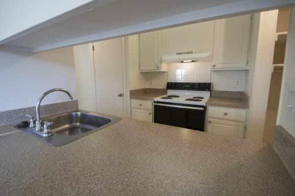This is a photo of the kitchen of a 1086 square foot 2 bedroom  apartment at Cambridge Court Apartments in Dallas, TX.