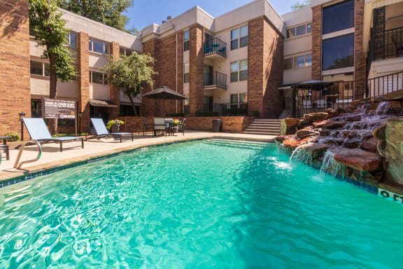 This is a photo of the primary pool area at Cambridge Court Apartments in Dallas, TX.