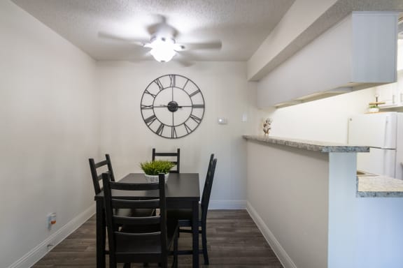 This is a photo of the dining area of the 515 square foot 1 bedroom apartment at Canyon Creek Apartments in Dallas, TX