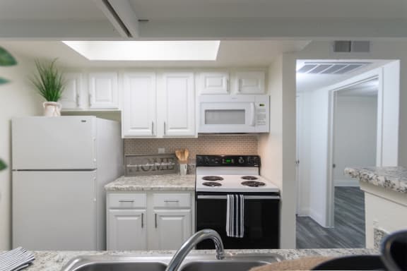 This is a photo of the kitchen of the 575 square foot 1 bedroom, 1 bath apartment at Canyon Creek Apartments in Dallas, TX