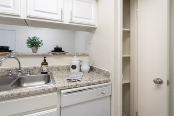 This is a photo of the kitchen pantry of the 575 square foot 1 bedroom, 1 bath apartment at Canyon Creek Apartments in Dallas, TX
