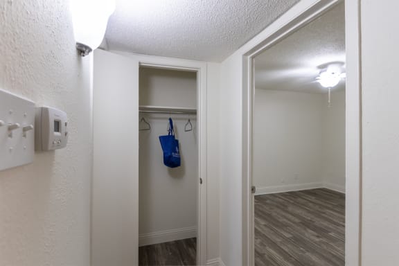 This is a photo of the hallway closet of the 575 square foot 1 bedroom, 1 bath apartment at Canyon Creek Apartments in Dallas, TX