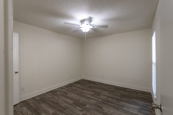 This is a photo of the bedroom of the 575 square foot 1 bedroom, 1 bath apartment at Canyon Creek Apartments in Dallas, TX