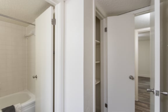 This is a photo of the bathroom linen closet of the 575 square foot 1 bedroom, 1 bath apartment at Canyon Creek Apartments in Dallas, TX