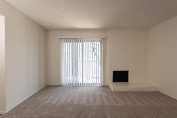 This is a photo of the living room in the 880 square foot 2 bedroom, 2 bath apartment at Canyon Creek Apartments in Dallas, TX