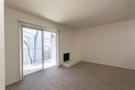 This is a photo of the living room in the 880 square foot 2 bedroom, 2 bath apartment at Canyon Creek Apartments in Dallas, TX