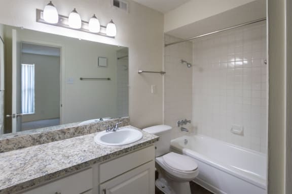 This is a photo of the primary bathroom of the 880 square foot 2 bedroom, 2 bath apartment at Canyon Creek Apartments in Dallas, TX