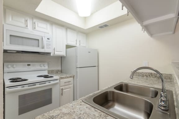 This is a photo of the kitchen in a 515 square foot 1 bedroom, 1 bath apartment at Canyon Creek Apartments in Dallas, TX