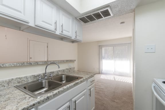 This is a photo of the kitchen in a 515 square foot 1 bedroom, 1 bath apartment at Canyon Creek Apartments in Dallas, TX