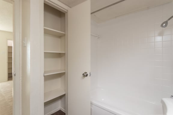This is a photo of the linen closet in the bathroom of the 515 square foot 1 bedroom, 1 bath apartment at Canyon Creek Apartments in Dallas, TX