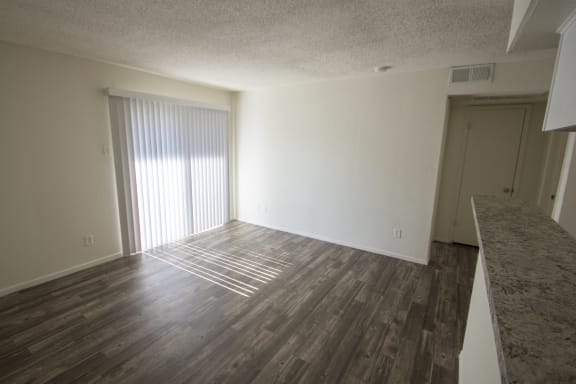This is a photo of the living room of the 550 square foot 1 bedroom apartment at Canyon Creek Apartments in Dallas, TX