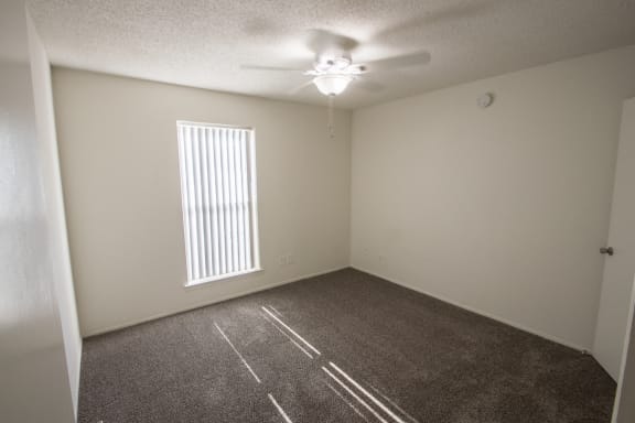 This is a photo of the bedroom of the 550 square foot 1 bedroom apartment at Canyon Creek Apartments in Dallas, TX