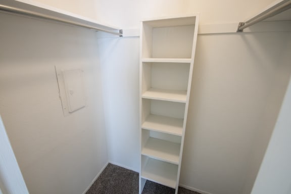 This is a photo of the walk-in closet in the bedroom of the 550 square foot 1 bedroom apartment at Canyon Creek Apartments in Dallas, TX