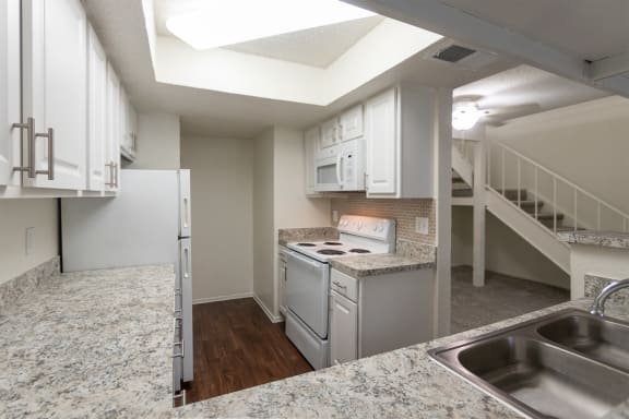 This is a photo of the kitchen in a 717 square foot 1 bedroom, 1 bath apartment at Canyon Creek Apartments in Dallas, TX