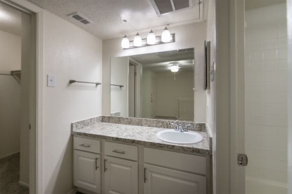 This is a photo of the bathroom vanity in a 717 square foot 1 bedroom, 1 bath apartment at Canyon Creek Apartments in Dallas, TX