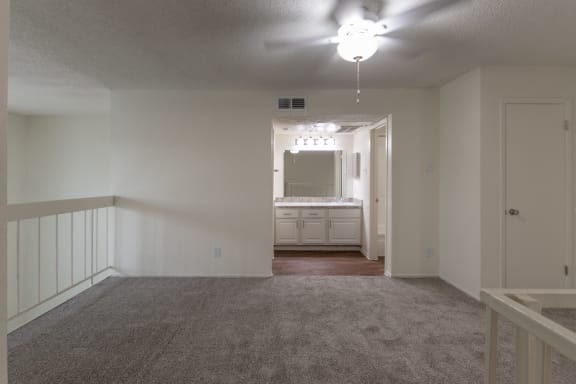 This is a photo of the loft/bedroom in a 717 square foot 1 bedroom, 1 bath apartment at Canyon Creek Apartments in Dallas, TX