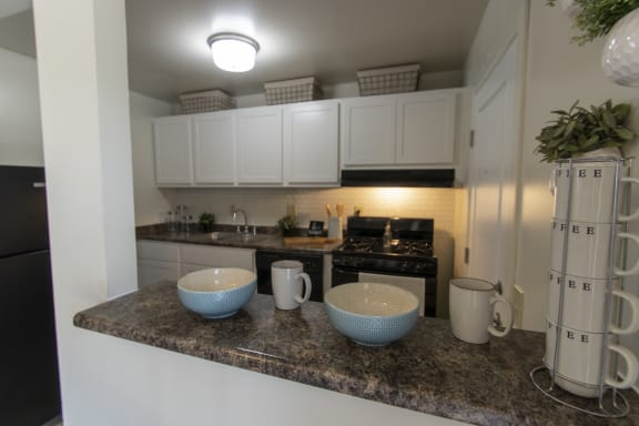 This is a photo of the kitchen in the 740 square foot 1 bedroom model apartment at Compton Lake Apartments in Mt. Healthy, OH.