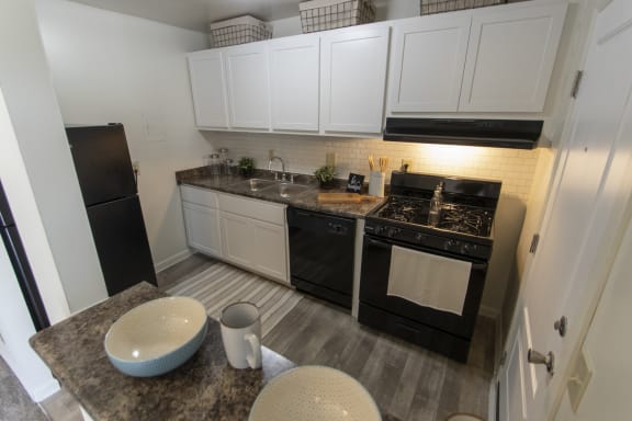 This is a photo of the kitchen in the 740 square foot 1 bedroom model apartment at Compton Lake Apartments in Mt. Healthy, OH.