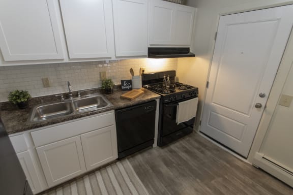 This is a photo of the kitchen in the 740 square foot 1 bedroom model apartment at Compton Lake Apartments in Mt. Healthy, OH.