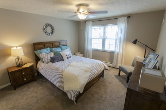 This is a photo of the bedroom in the 740 square foot 1 bedroom model apartment at Compton Lake Apartments in Mt. Healthy, OH.