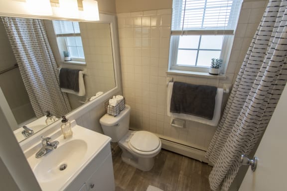 This is a photo of the bathroom in the 740 square foot 1 bedroom model apartment at Compton Lake Apartments in Mt. Healthy, OH.