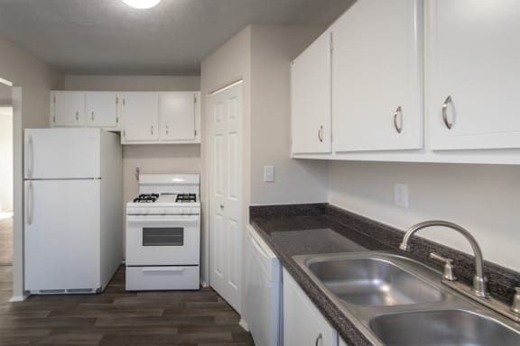 This is a photo of the kitchen of the 1004 square foot, 2 bedroom/1 bath Townhome with stackable washer/dryer floor plan at Colonial Ridge Apartments in the Pleasant Ridge neighborhood of Cincinnati, OH.