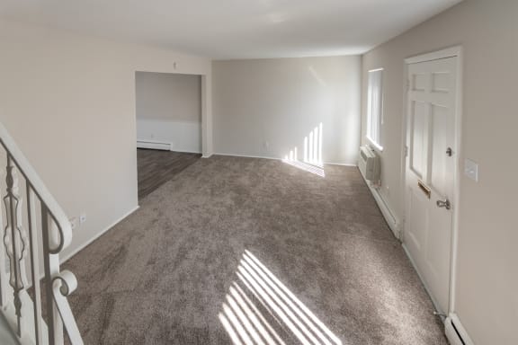 This is a photo of the living room of the 1004 square foot, 2 bedroom/1 bath Townhome with stackable washer/dryer floor plan at Colonial Ridge Apartments in the Pleasant Ridge neighborhood of Cincinnati, OH.