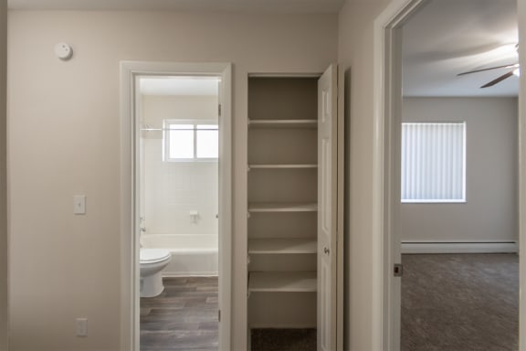 This is a photo of the hallway linen closet of the 1004 square foot, 2 bedroom/1 bath Townhome with stackable washer/dryer floor plan at Colonial Ridge Apartments in the Pleasant Ridge neighborhood of Cincinnati, OH.