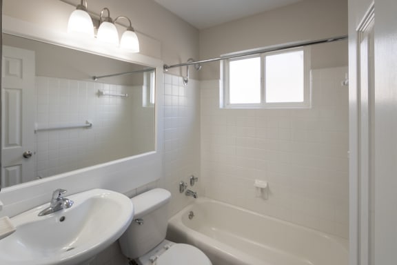 This is a photo of the bathroom of the 1004 square foot, 2 bedroom/1 bath Townhome with stackable washer/dryer floor plan at Colonial Ridge Apartments in the Pleasant Ridge neighborhood of Cincinnati, OH.
