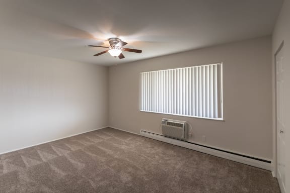 This is a photo of the primary bedroom of the 1004 square foot, 2 bedroom/1 bath Townhome with stackable washer/dryer floor plan at Colonial Ridge Apartments in the Pleasant Ridge neighborhood of Cincinnati, OH.