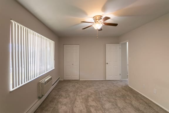 This is a photo of the primary bedroom of the 1004 square foot, 2 bedroom/1 bath Townhome with stackable washer/dryer floor plan at Colonial Ridge Apartments in the Pleasant Ridge neighborhood of Cincinnati, OH.