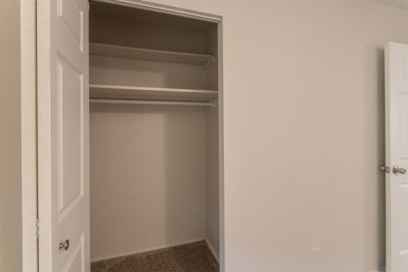 This is a photo of the primary bedroom closet of the 1004 square foot, 2 bedroom/1 bath Townhome with stackable washer/dryer floor plan at Colonial Ridge Apartments in the Pleasant Ridge neighborhood of Cincinnati, OH.