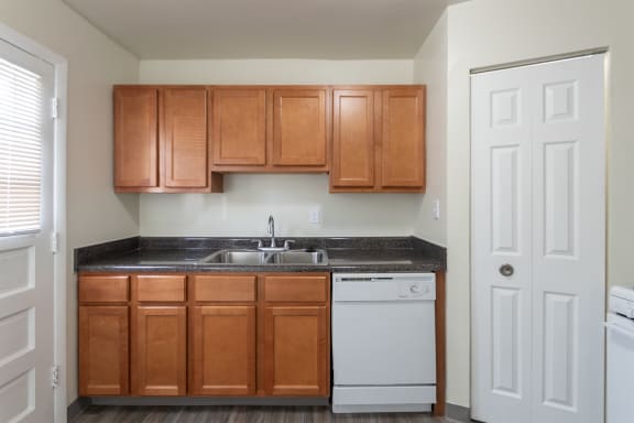 This is a photo of the kitchen of the 1004 square foot, 2 bedroom/1 bath Townhome with stackable washer/dryer floor plan at Colonial Ridge Apartments in the Pleasant Ridge neighborhood of Cincinnati, OH.