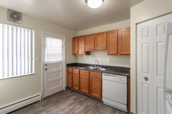 This is a photo of the kitchen of the 1004 square foot, 2 bedroom/1 bath Townhome with stackable washer/dryer floor plan at Colonial Ridge Apartments in the Pleasant Ridge neighborhood of Cincinnati, OH.