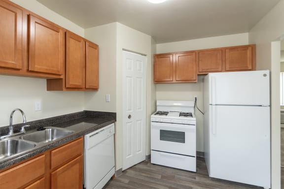 This is a photo of the kitchen of the 1004 square foot, 2 bedroom/1 bath Townhome with stackable washer/dryer floor plan at Colonial Ridge Apartments in the Pleasant Ridge neighborhood of Cincinnati, OH.