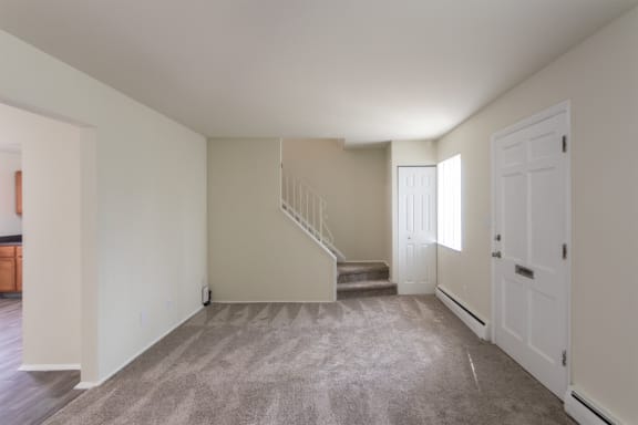 This is a photo of the living room of the 1004 square foot, 2 bedroom/1 bath Townhome with stackable washer/dryer floor plan at Colonial Ridge Apartments in the Pleasant Ridge neighborhood of Cincinnati, OH.