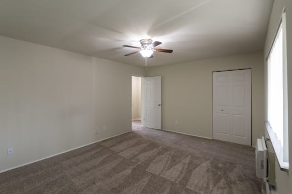 This is a photo of the primary bedroom of the 1004 square foot, 2 bedroom/1 bath Townhome with stackable washer/dryer floor plan at Colonial Ridge Apartments in the Pleasant Ridge neighborhood of Cincinnati, OH.