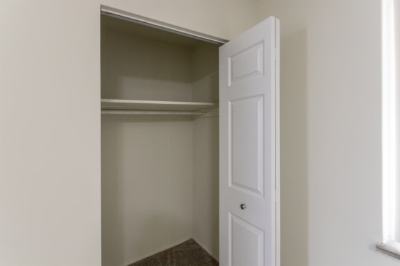 This is a photo of the primary bedroom closet of the 1004 square foot, 2 bedroom/1 bath Townhome with stackable washer/dryer floor plan at Colonial Ridge Apartments in the Pleasant Ridge neighborhood of Cincinnati, OH.
