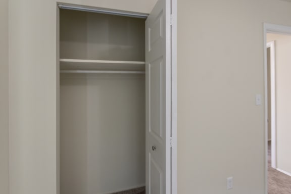 This is a photo of the second bedroom closet of the 1004 square foot, 2 bedroom/1 bath Townhome with stackable washer/dryer floor plan at Colonial Ridge Apartments in the Pleasant Ridge neighborhood of Cincinnati, OH.
