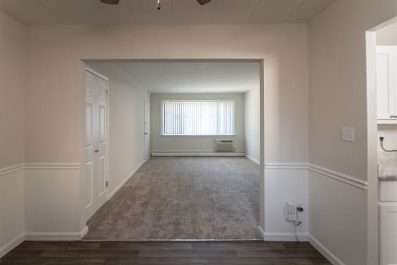 This is a photo of the living room from the dining room in the 631 square foot, 1 bedroom/1 bath Montgomery floor plan at Colonial Ridge Apartments in the Pleasant Ridge neighborhood of Cincinnati, OH.