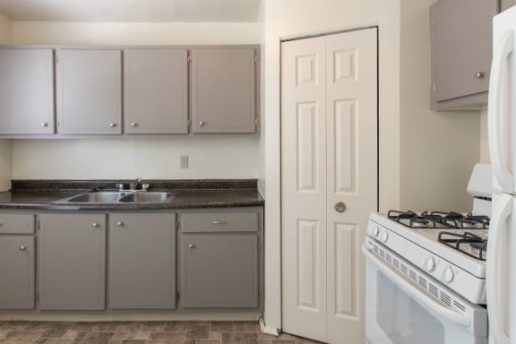 This is a photo of the kitchen in the 1004 square foot, 2 bedroom townhome floor plan at Colonial Ridge Apartments in Cincinnati, OH.