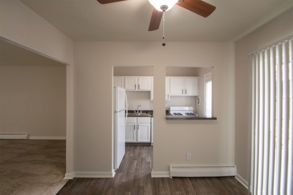 This is a photo of the dining room from the kitchen pass through window in the 631 square foot, B-style (Ranch) 1 bedroom/1 bath floor plan at Colonial Ridge Apartments in the Pleasant Ridge neighborhood of Cincinnati, OH.