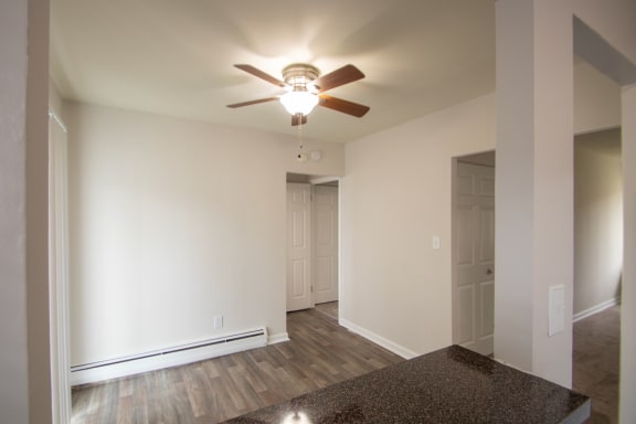 This is a photo of the dining room from the kitchen pass through window in the 631 square foot, B-style (Ranch) 1 bedroom/1 bath floor plan at Colonial Ridge Apartments in the Pleasant Ridge neighborhood of Cincinnati, OH.